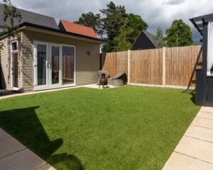 Artificial grass 2 such as PermaLawn pictured is a smart convenient and aesthetically pleasing solution
