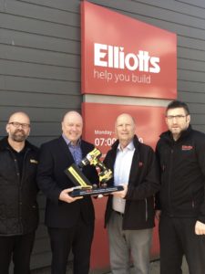 DeWalts General Sales Manager Mick Gill presents a 175th anniversary commemorative trophy to Elliotts Chariman Stuart Mason Elliott