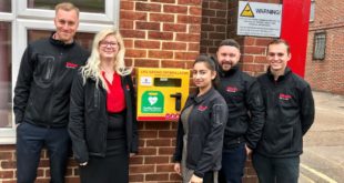Elliotts employees with one of the new 24 hour access defibrillators