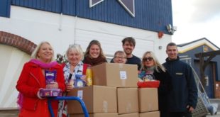 Monica Hartley 2nd from right and colleagues with Foodbank items